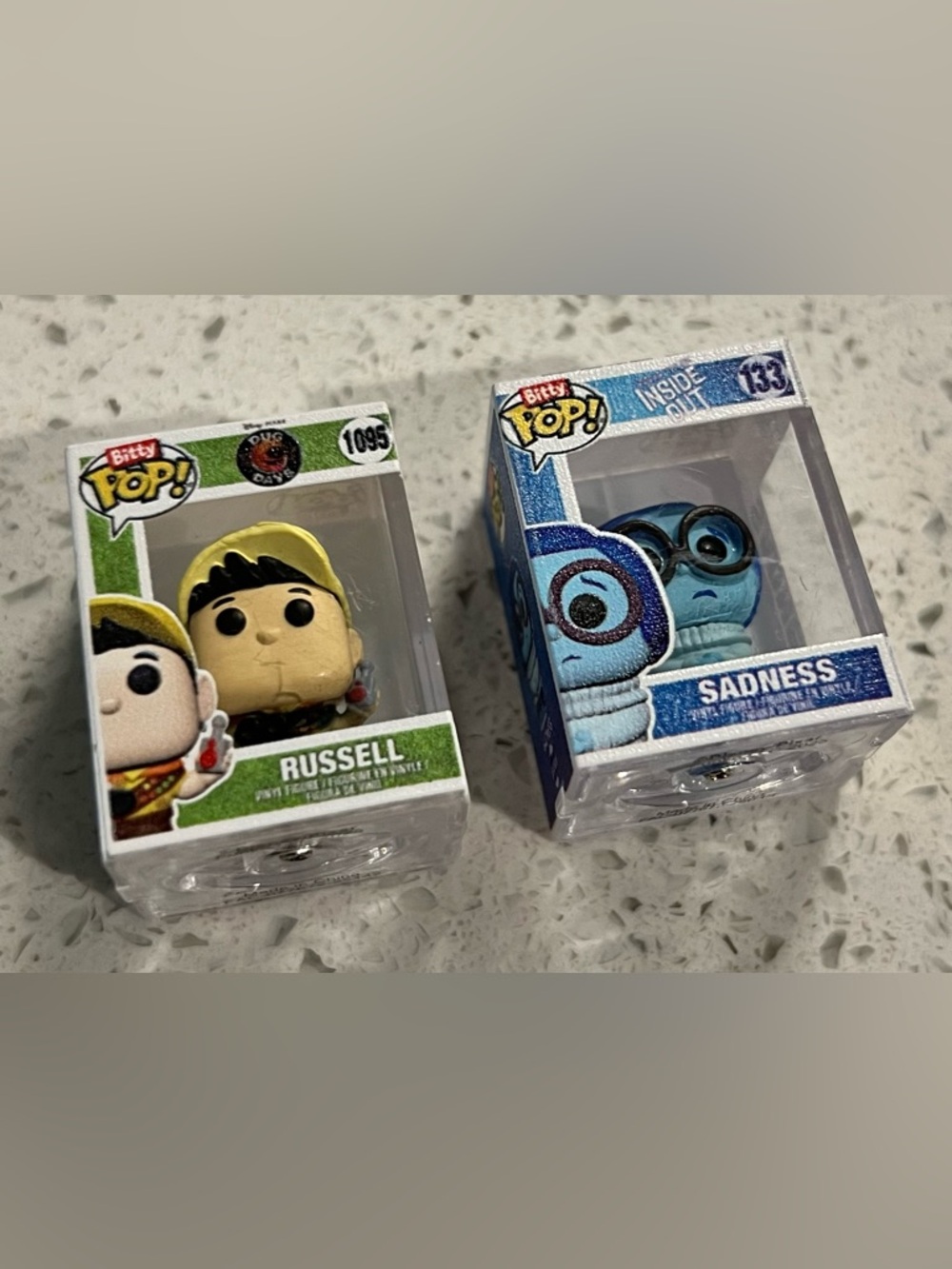 Funko Bitty Pop! Figures Sadness (#133) and Russell (#1095)